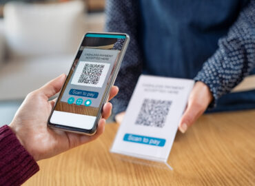 customer-hand-scanning-qr-code